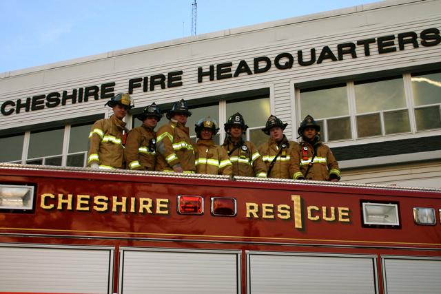 Fire Fighters from Fire Headquarters pose on top of Rescue 1. April 5, 2010.